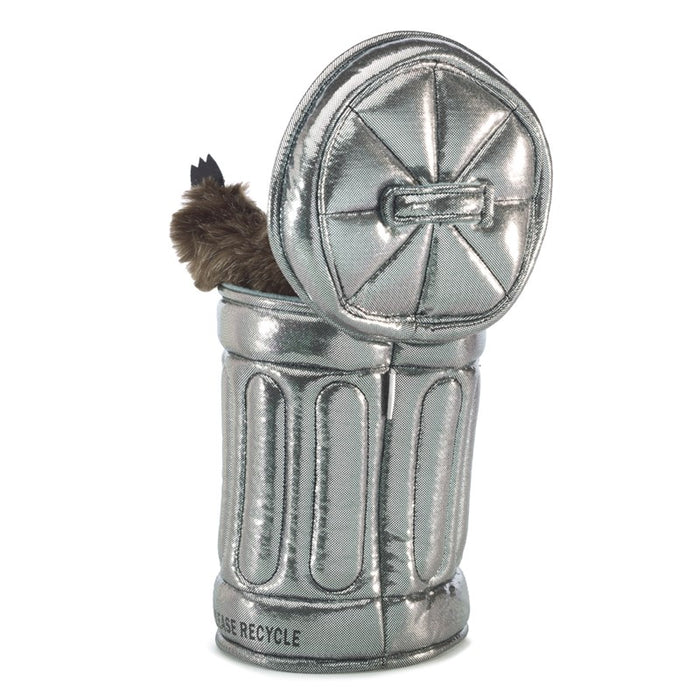 The image shows the back of the puppet, with one paw raised from a silver garbage can that has a ridged, metal texture.