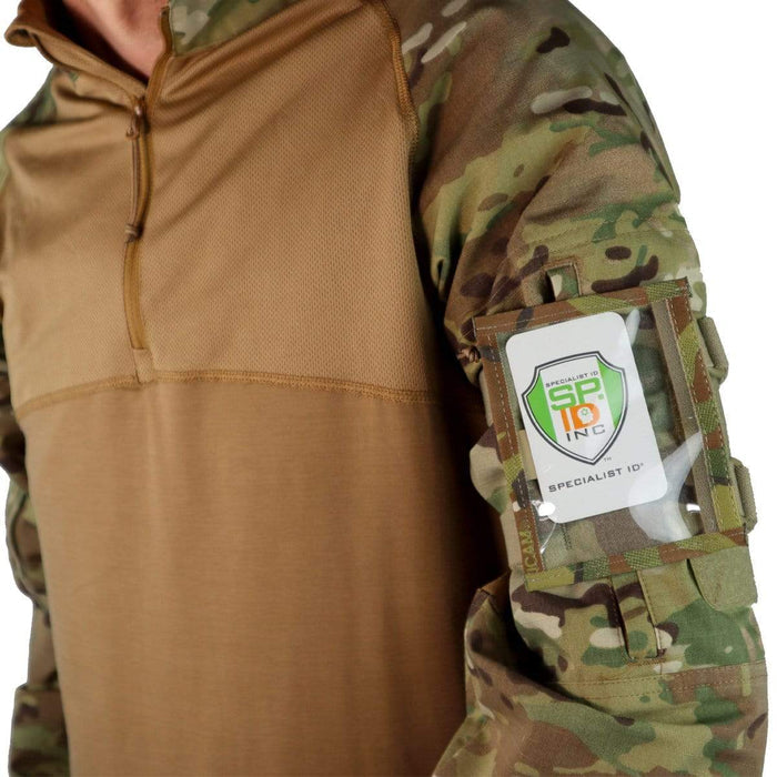 A person wearing a camouflage military uniform with a Raine Military ID Badge Armband Holder with Two Straps (SPID-1090) containing an ID card attached to their upper arm. Sold by Specialist ID.