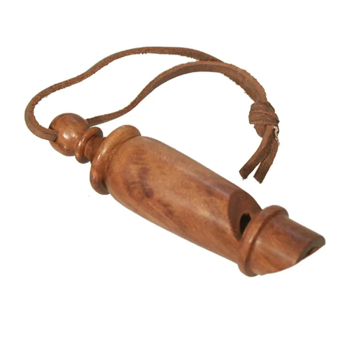 Wooden whistle with a rope on a white background