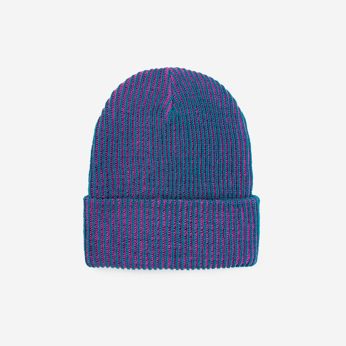 This is a soft, ribbed two-tone Pigeon - Teal Magenta knit beanie designed for all genders. It has a clean, smooth shape that fits evenly on the head without bumps or visible seams. The beanie is made from 100% acrylic and feels cozy and lightweight. When laid flat and unstretched, it measures about 8.5 inches wide and 12 inches long. It’s intended for everyday wear, easy styling, and gifting.