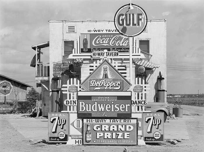 Signs in front of highway tavern. Crystal City, Texas