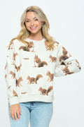 An off‑white, cozy cotton‑blend sweatshirt shown on a model. The fabric is smooth and soft, with a flat, all‑over printed pattern of small brown and white squirrels in playful poses. It has a classic crew neckline and a slightly cropped, relaxed shape designed for comfortable everyday wear.