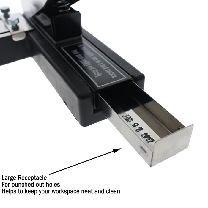 A Stapler-Style Slot Punch With Adjustable Guide (P/N SPID-9750) with a large receptacle for collected paper holes. The text on the receptacle reads "Jan 05 2017," and an arrow points to it with a note about keeping the workspace clean. Featuring a non-slip rubber base, this heavy-duty stapler-style tool ensures precise, stable use.