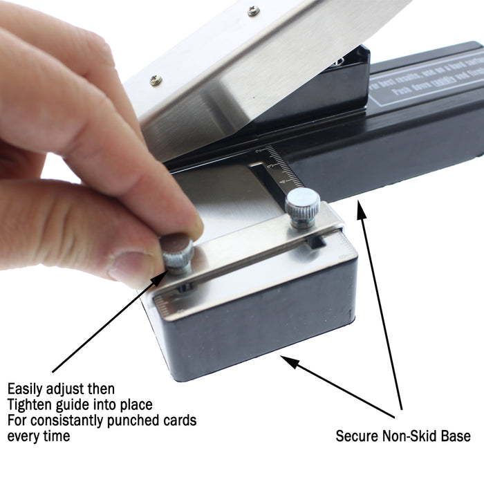 Close-up of a hand adjusting a metal guide on a black base with screws labeled "Easily adjust then tighten guide into place" and "Secure Non-Skid Base," for consistently punched cards using a Stapler-Style Slot Punch With Adjustable Guide (P/N SPID-9750).