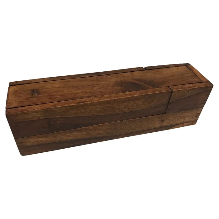 Rectangular traveling writing instrument box made of smooth teak wood, shown closed. The warm brown wood has visible grain and a simple, sturdy construction. The box is shaped to hold a square glass inkwell and a wooden nib pen (not included), designed to keep writing tools neatly contained and easy to carry. The overall feel is solid, refined, and reminiscent of historic travel writing kits.