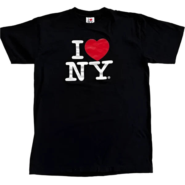 This T‑shirt features the iconic ‘I Heart NY’ design: a bold white letter ‘I,’ a bright red heart, and the letters ‘NY’ in bold white text, all set against a black background.