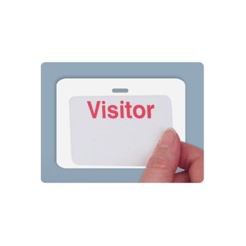 A hand holds a white card with the word "Visitor" in red letters, positioned against a gray background. The Reusable 3 x 3 Cardbacker - Badge Holder, Box of 500 (P/N 08177) ensures that the adhesive sticker badge stays securely in place throughout your visit.