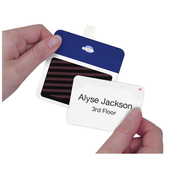 Hands assembling a self-expiring badge by applying a printed T6151 one-day front to a blue badge back