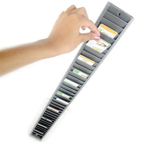 A hand reaching towards a Vertical ID Badge Rack Card Holder (P/N 3905-0150), meticulously organized with various cards stored in individual slots.