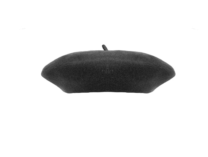 The image features a black beret made from soft, high‑quality felted wool that feels dense yet plush to the touch, with a gentle firmness that springs back when pressed. The hat has a smooth, rounded shape and a comfortable band that rests snugly around the head, allowing it to be worn tilted, pulled low for warmth, or pushed back. Overall, it offers a warm, sturdy, and luxurious feel that is both comforting and stylish.